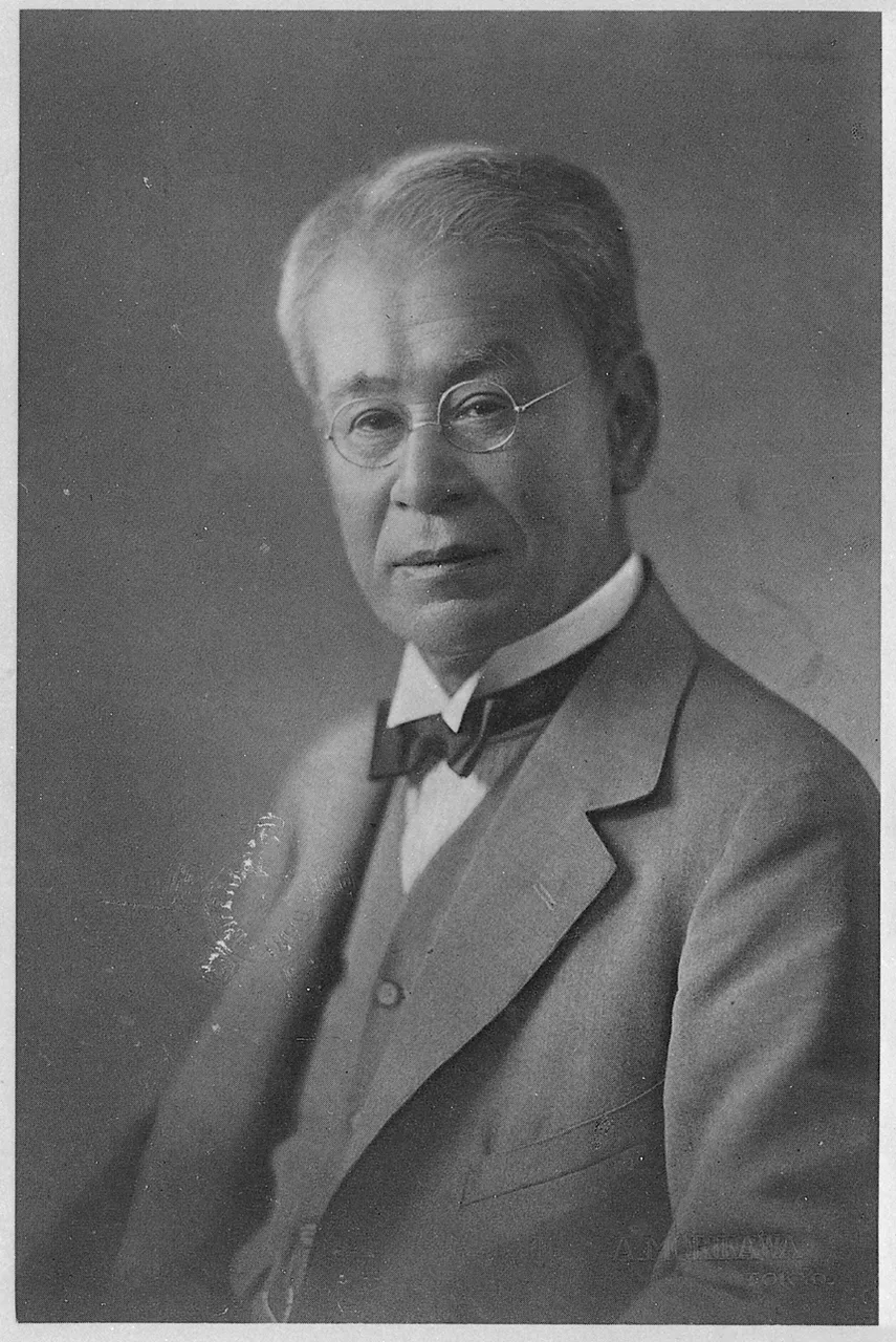 Botanist Tomitaro Makino seated at a desk with papers in 1934