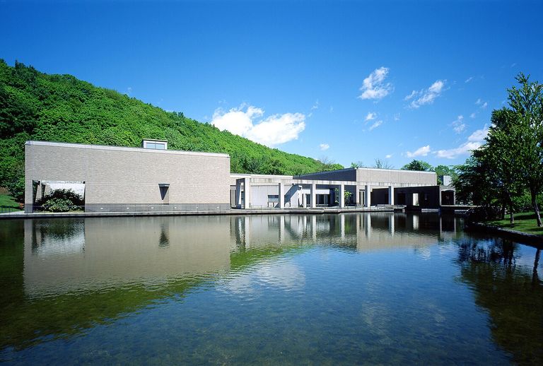 Exterior of Sapporo Art Museum against a green hillside