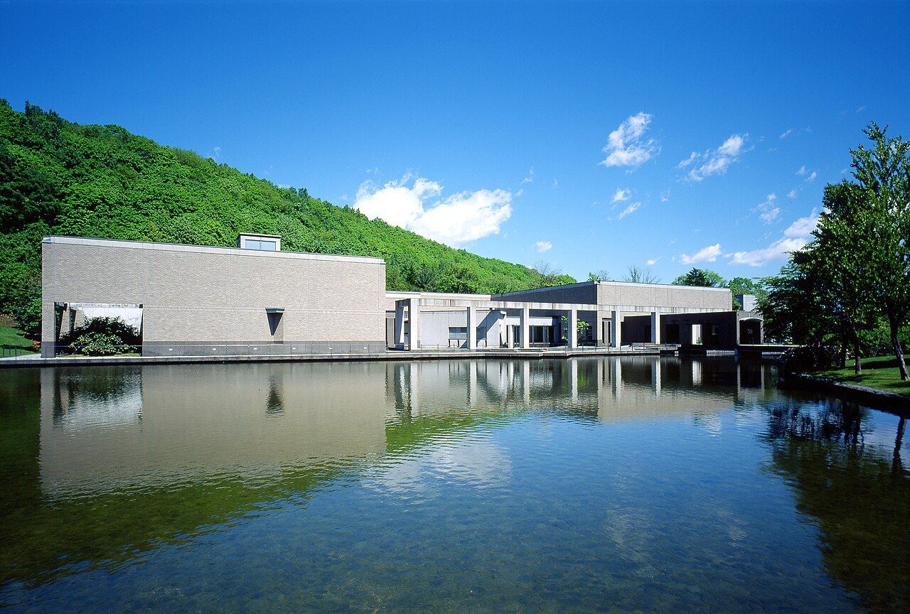 Exterior of Sapporo Art Museum against a green hillside